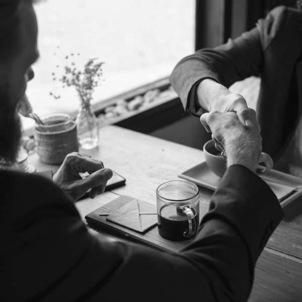 Business agreement handshake at coffee shop Business agreement handshake at coffee shop